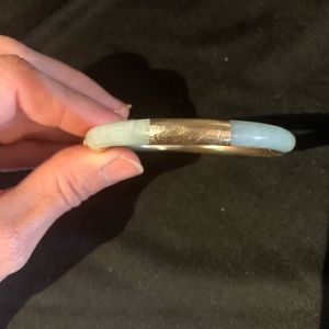 Jade and gold women’s bangle bracelet.